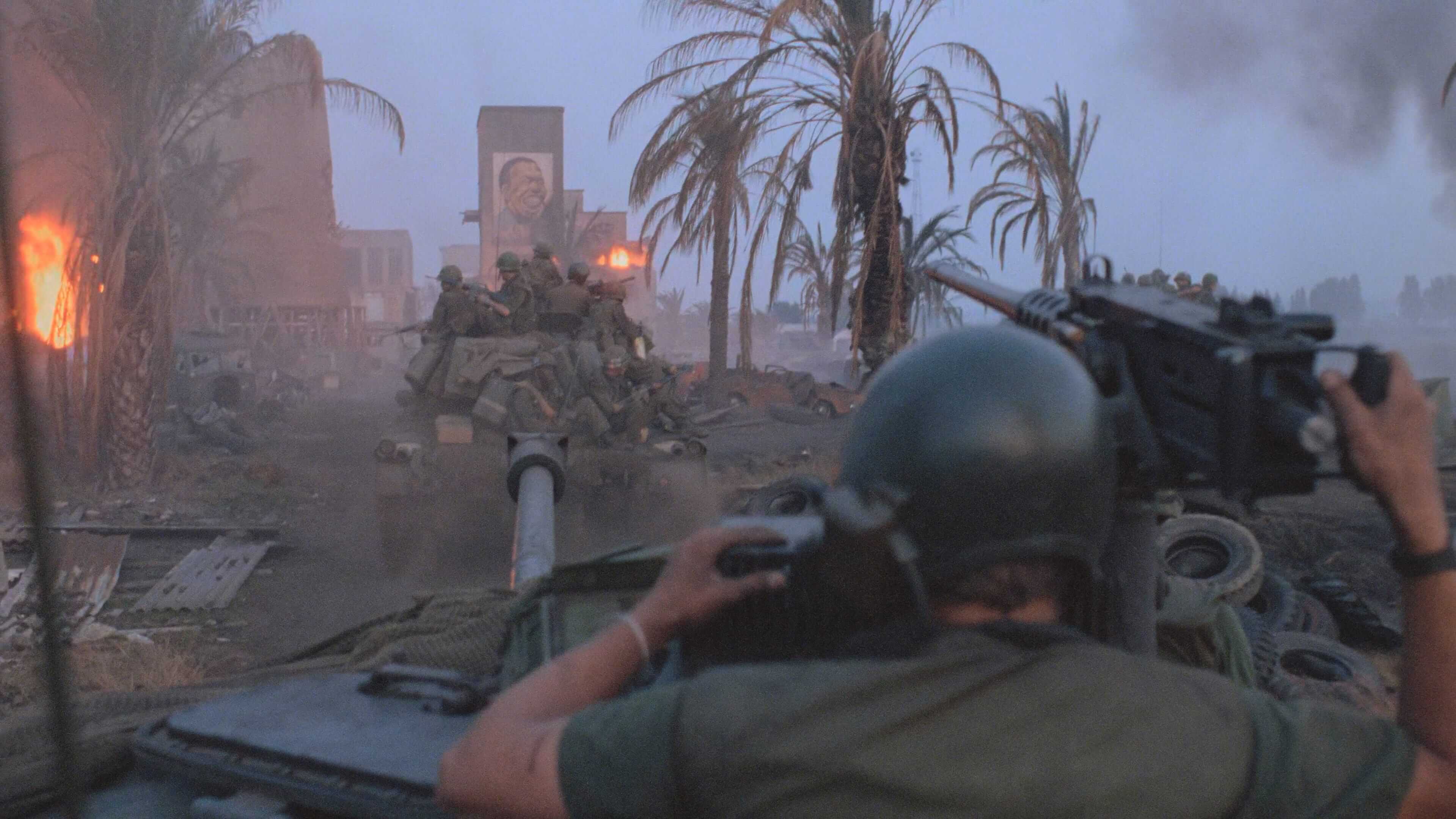 скриншот кадра с колонной техники в разбитом городе